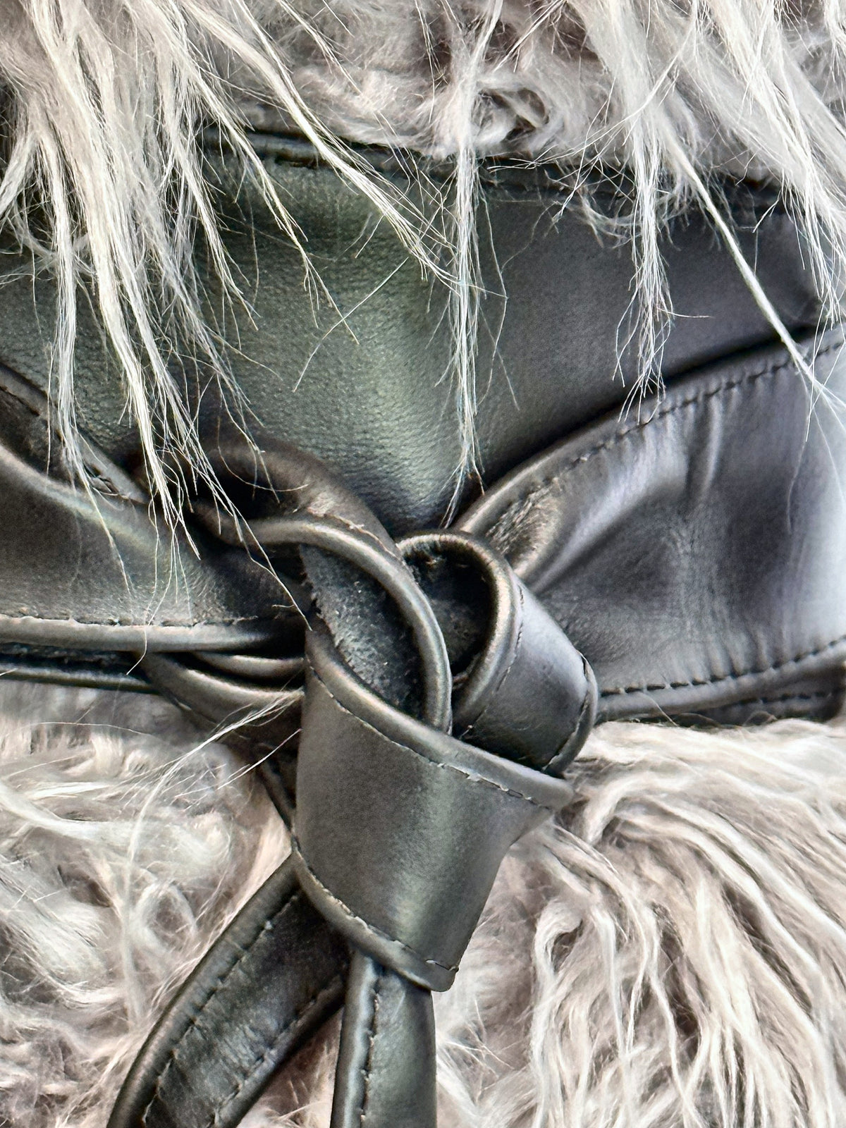 Close-up of the black leather obi belt loop knot