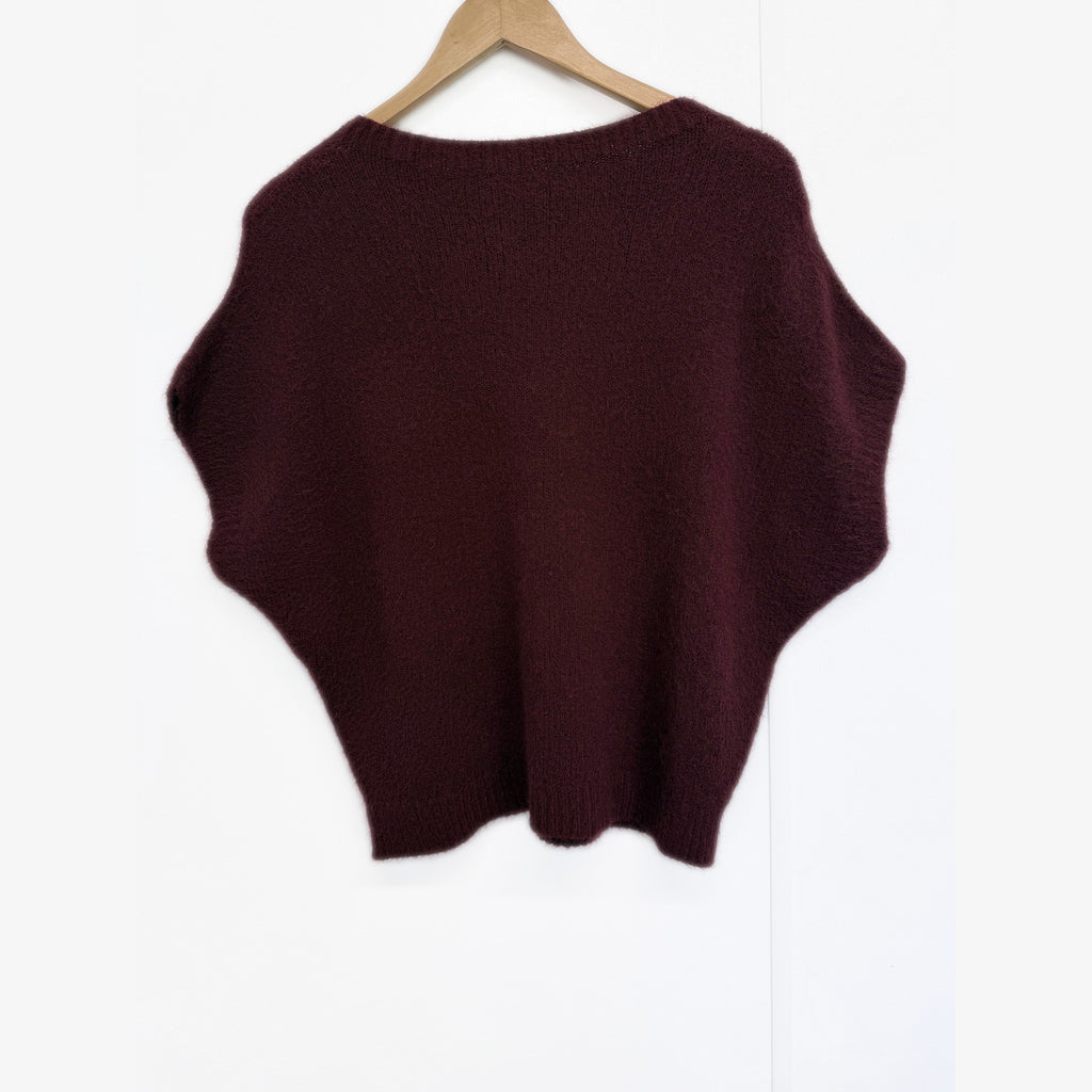 Burgundy knit tank top on hanger, back