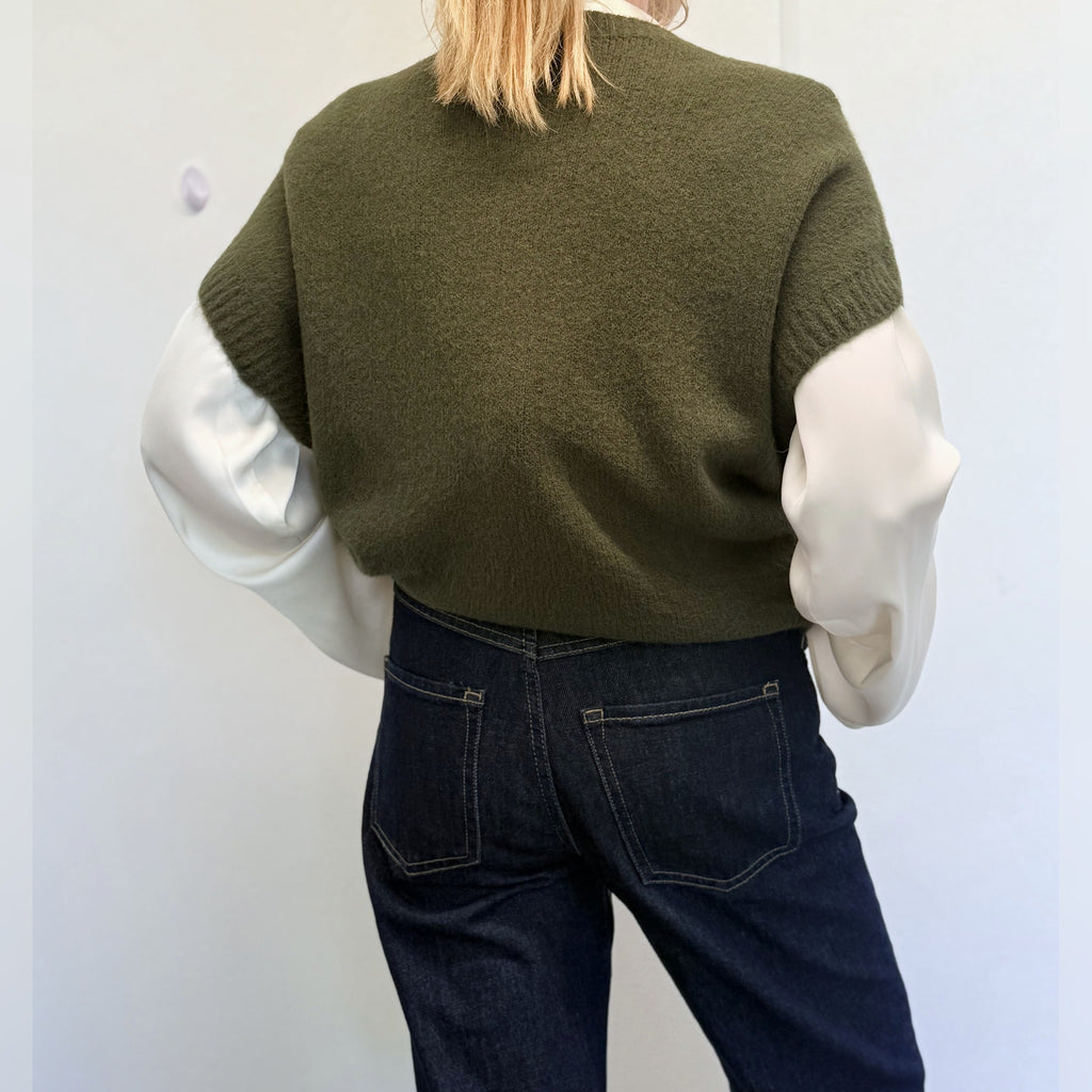 Khaki Forest Green knit tank top worn over a white shirt, back