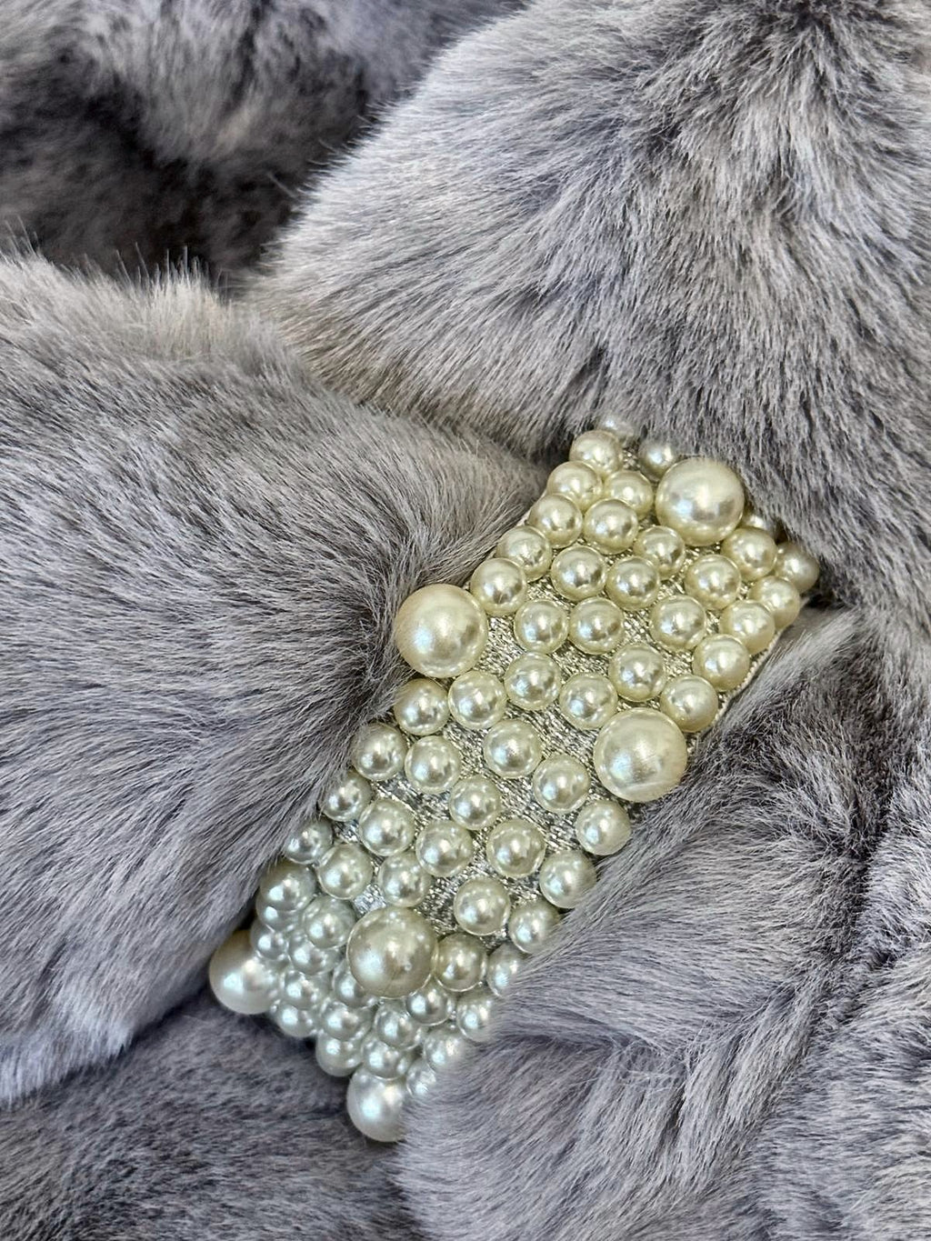 Pearl loop brooch detail on ultra-soft grey faux fur