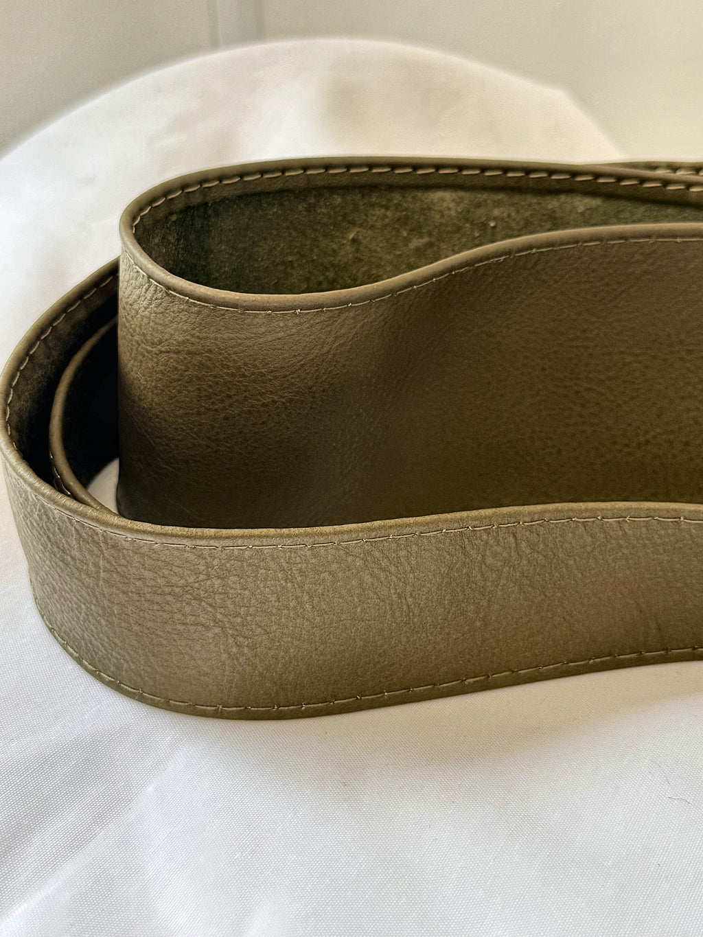 Close-up of the rolled Olive Khaki Green real leather obi belt