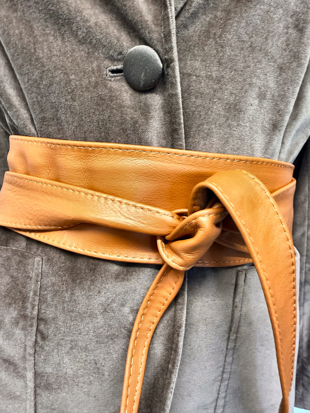Tan Italian leather wide obi sash belt tied over a grey velvet blazer